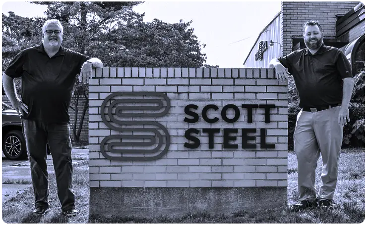 SCOTT_FamilyImg_0723 John Scott and Aaron Scott by the Scott Steel business sign